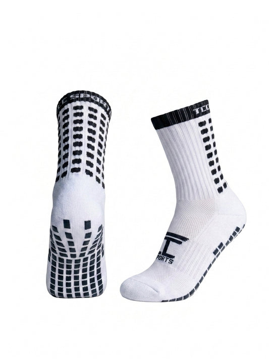 TCC Sports black and white grip socks showing the side profile and silicone grip sole.