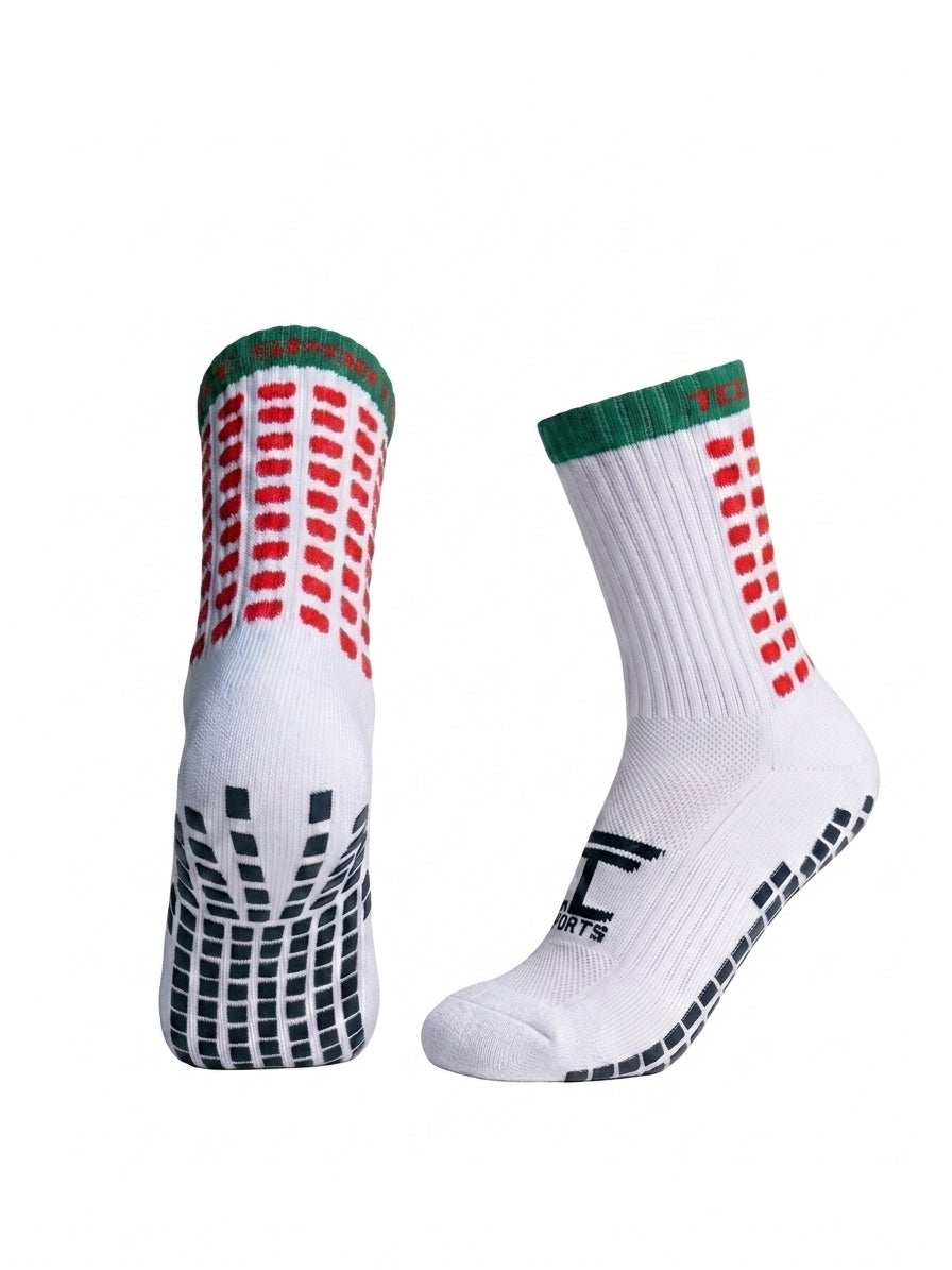 TCC Sports red and green grip socks showing the side profile and silicone grip sole.