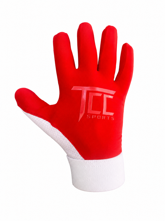 TCC Sports red and white strapless Gaelic glove, backhand view showing the TCC logo and white wrist cuff.